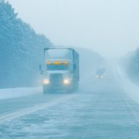 Semi-Truck Barrels Through Vehicles On Snowy...